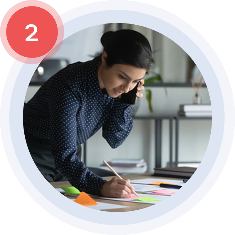 Step 2 - Asset collection. Woman on the phone collecting website assets from a client