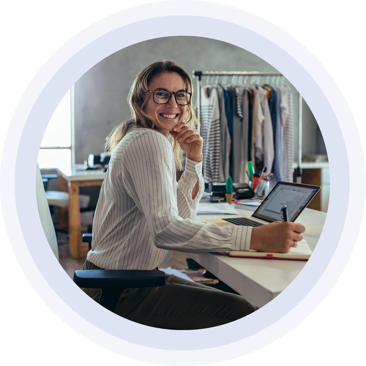 Female small business owner working at her desk and office