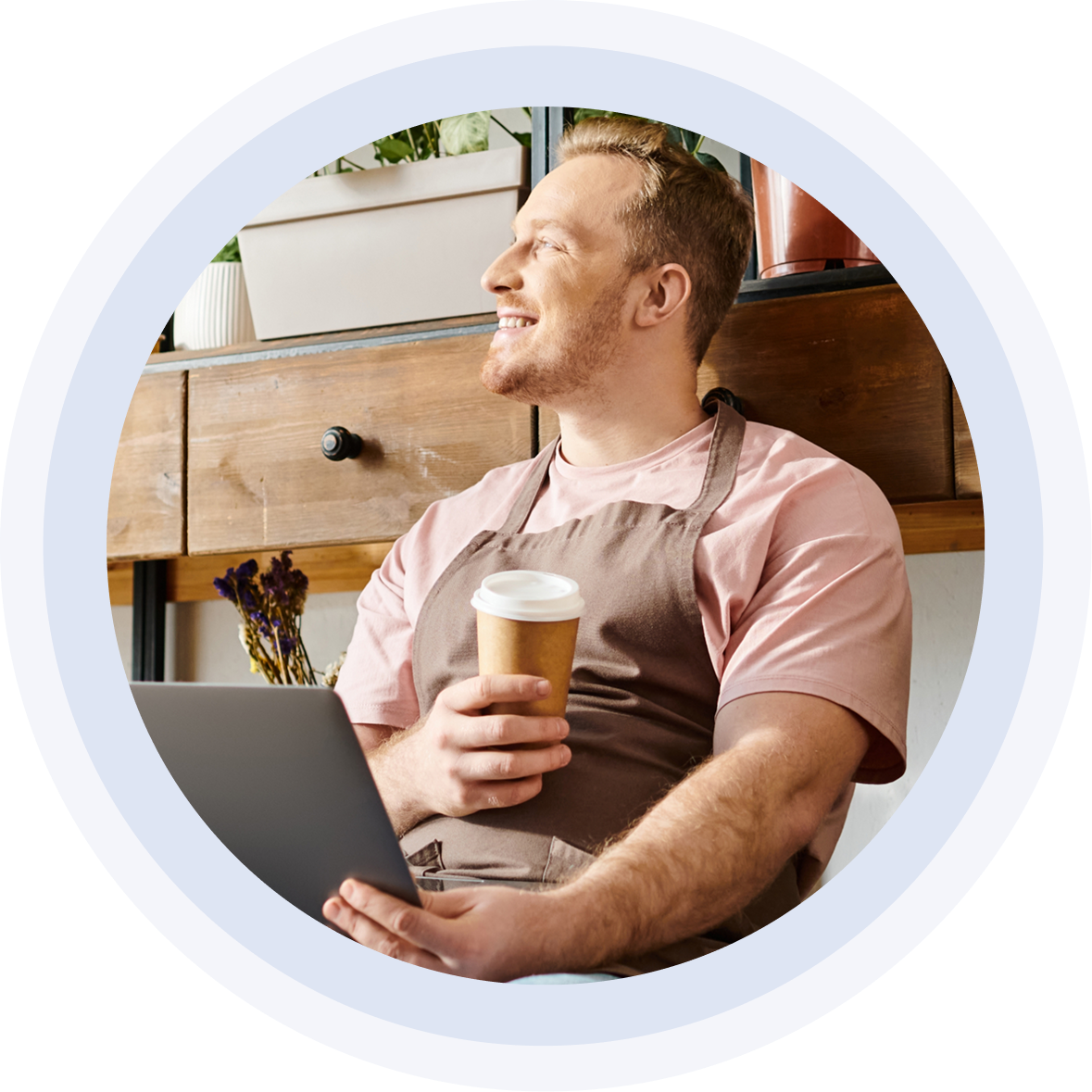 Business owner with a coffee and laptop - on top of his digital presence.