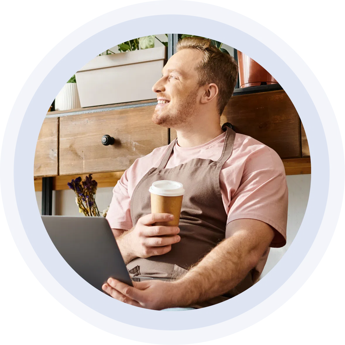 Business owner with a coffee and laptop - on top of his digital presence.